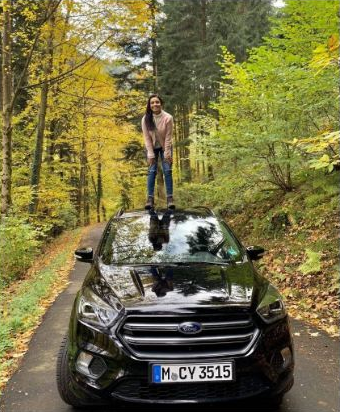 Posing on top of a car in Germany